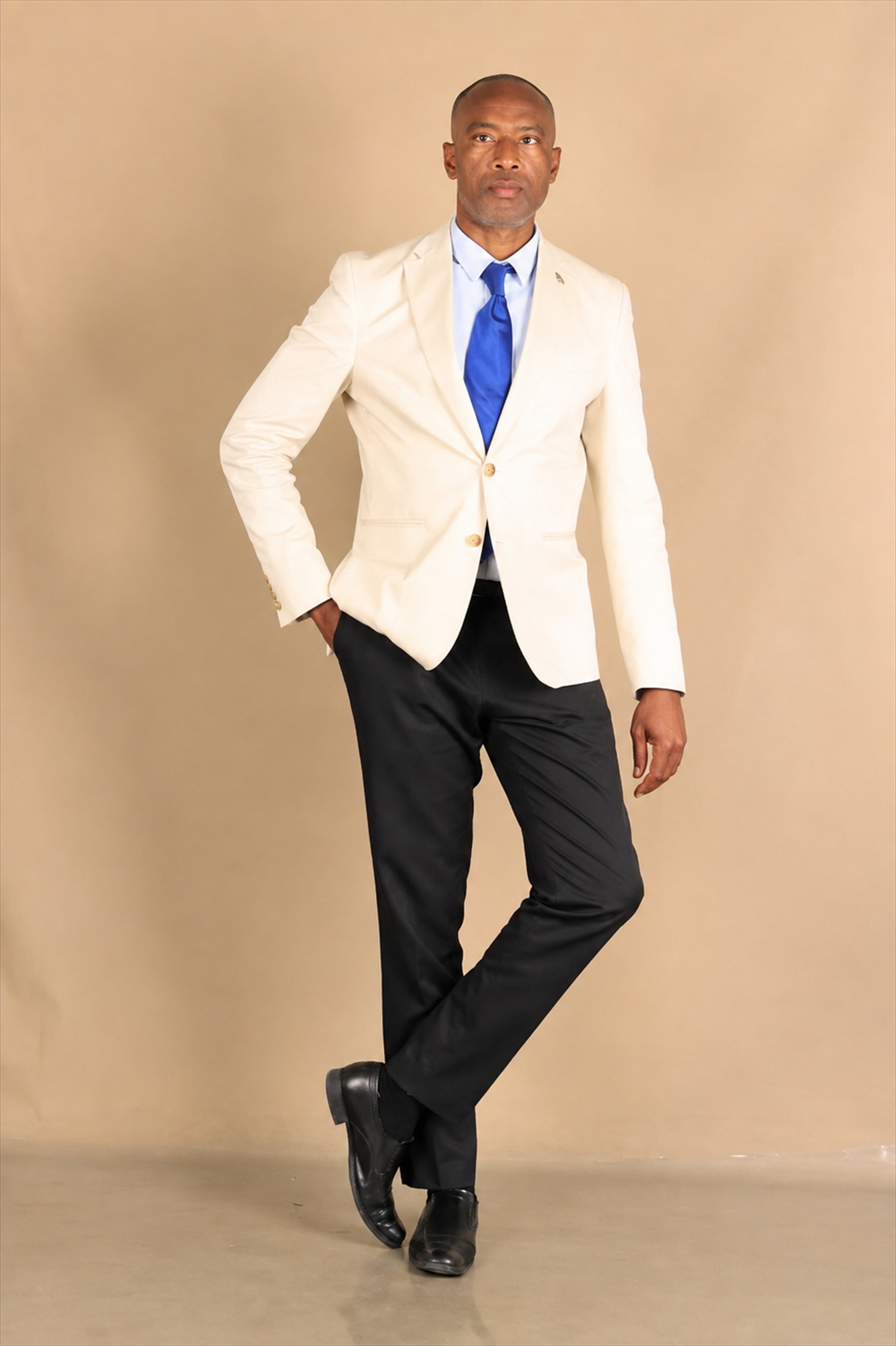 Simataa Lennon Limbo standing in formal attire